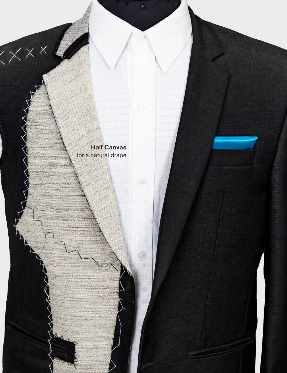 bust of a suit jacket half constructed showing the canvas material