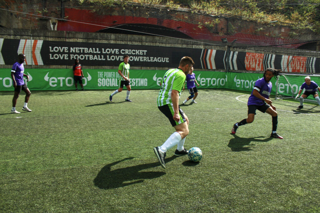 Adults playing football