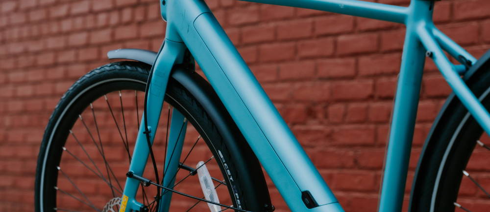 A green Tenways electric city bike