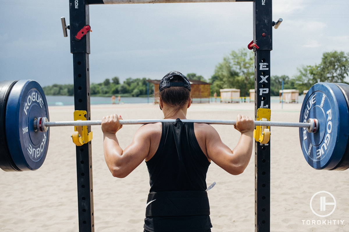 using barbell on the beach