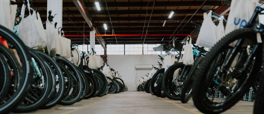 rows of bike tires in the Upway warehouse