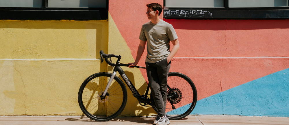 Rider standing next to Bianchi E-Impulso road e-Bike