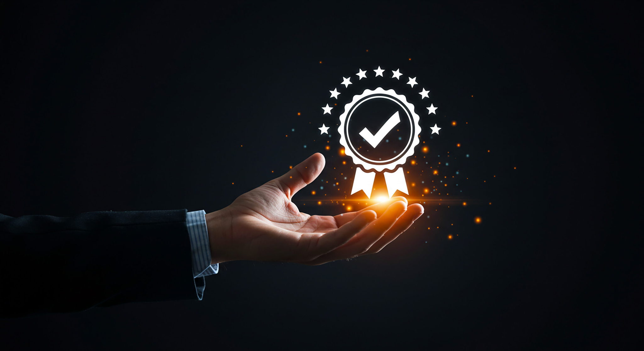 A hand in a suit holds a glowing digital badge featuring a check mark, stars, and light effects on a dark background, symbolizing achievement and quality approval.
