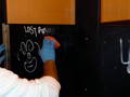 removing graffiti from bathroom stalls using graffiti safewipes