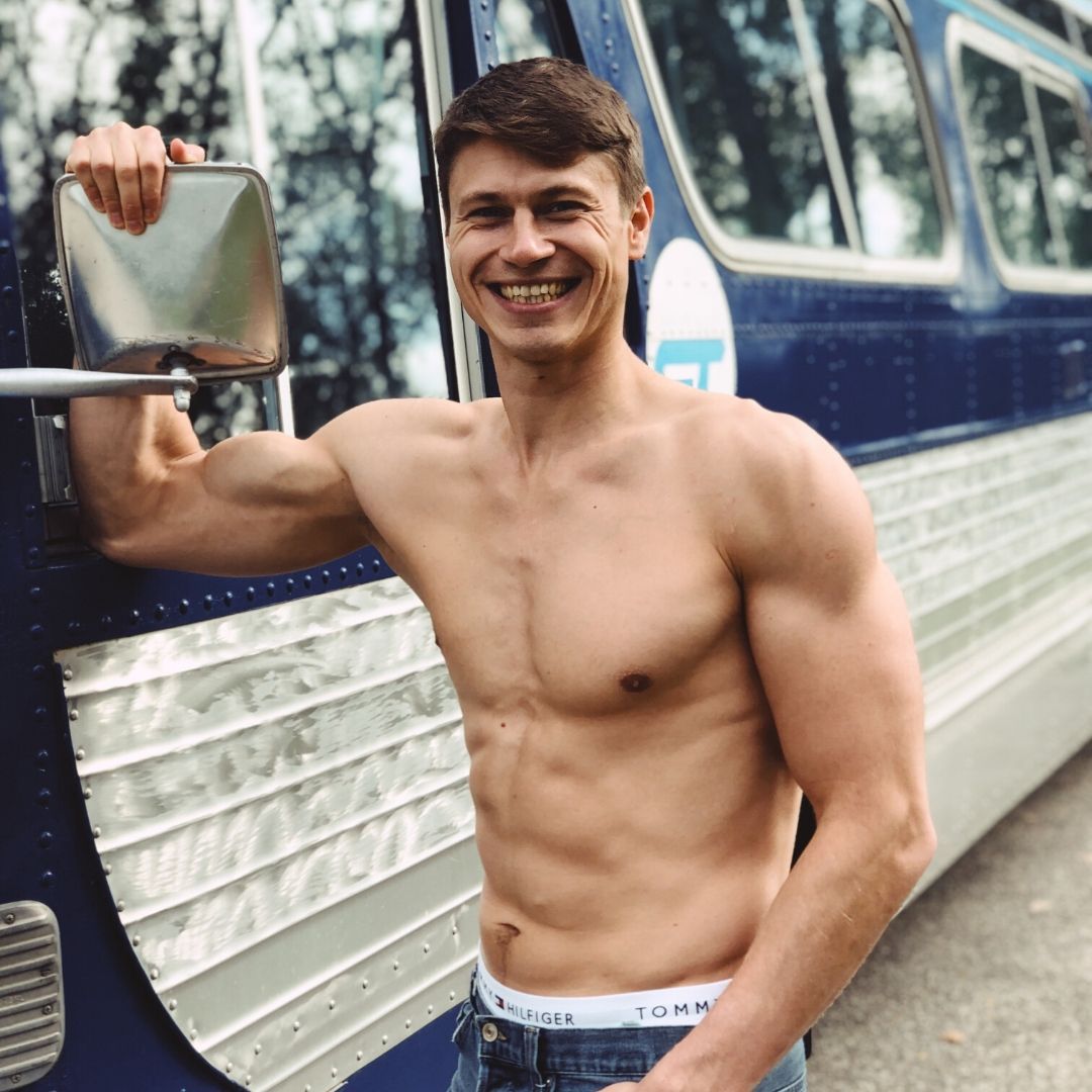 Oleksiy Kononov is standing near the bus