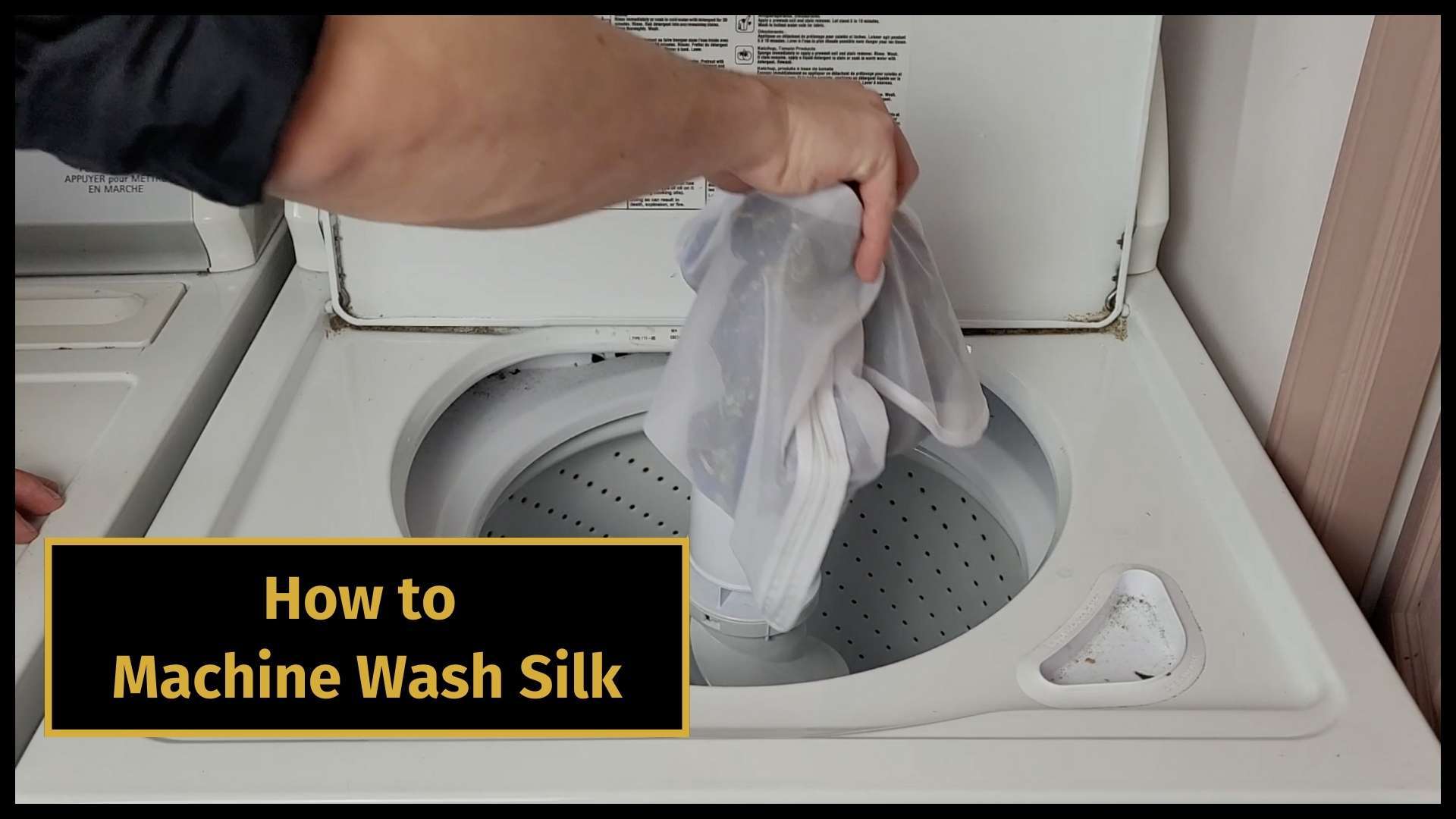 how to wash mulberry silk banner image with a picture of a man washing a mulberry silk shirt in the tub full of soapy water