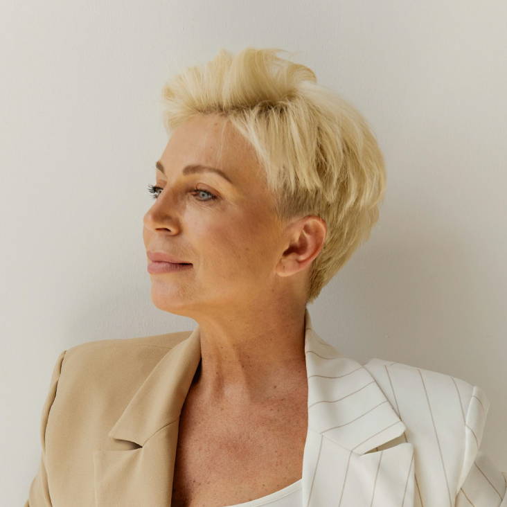 blonde woman with a pixie haircut