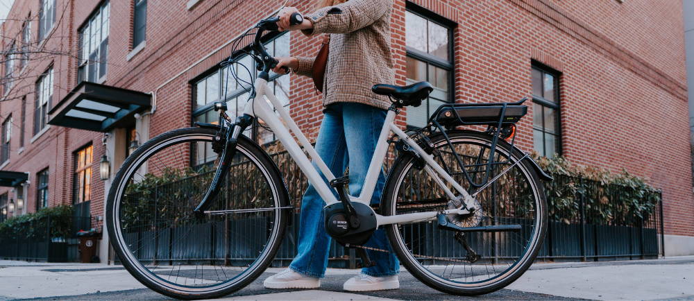 Rider walking with Gazelle MEdeo electric bike