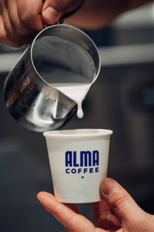 A cappuccino being poured. 