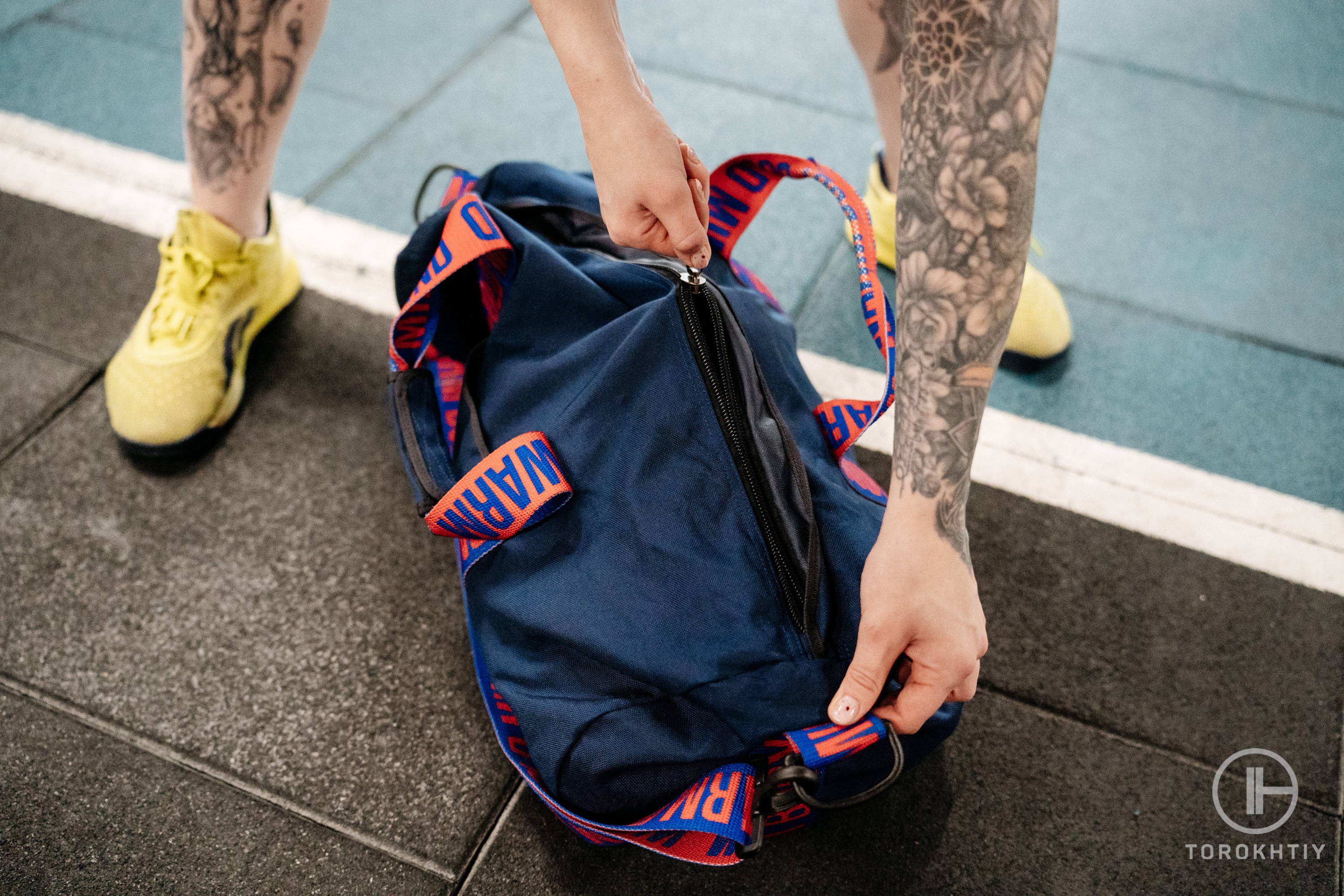 athlete in gym with powerlifting gym bag