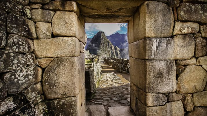 Machu Picchu's strategic ridge location provides stunning vistas of mountains and the Urubamba River valley