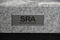 SRA custom isolation base badge close up