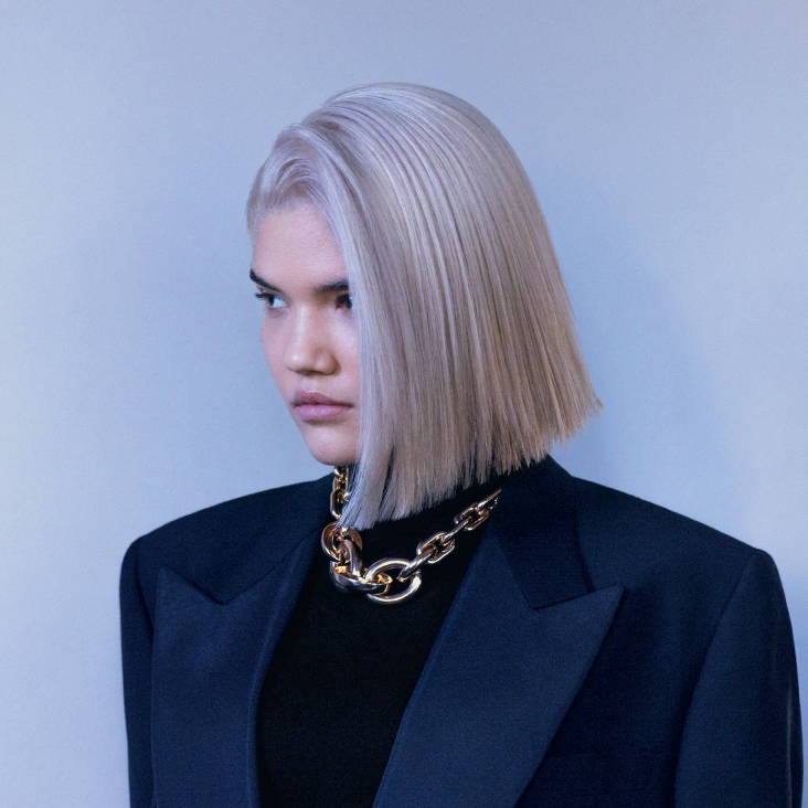 female model with platinum blonde hair cut to shoulder length