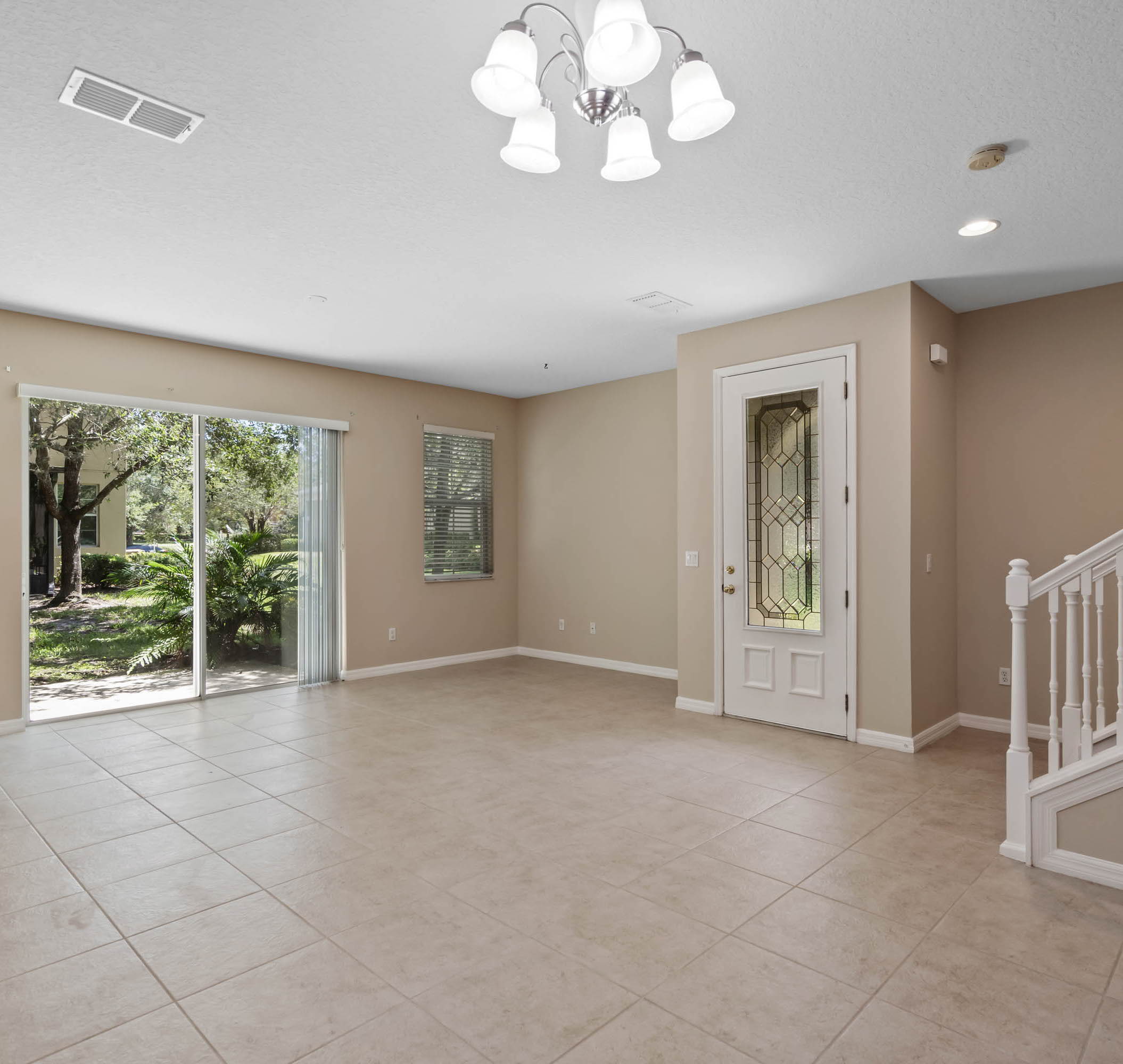 empty room featuring natural light and tile flooring