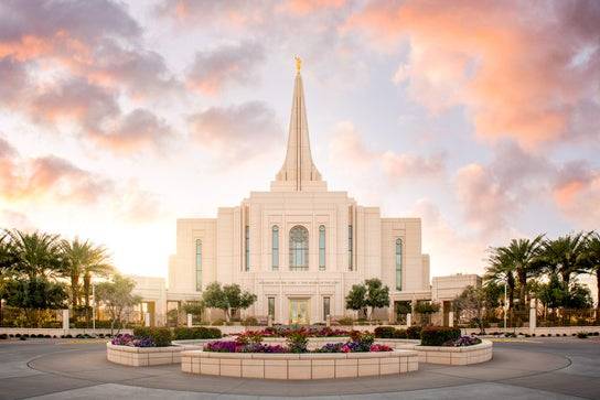Peaceful photo of the Gilbert Temple with the sun shining behind it.