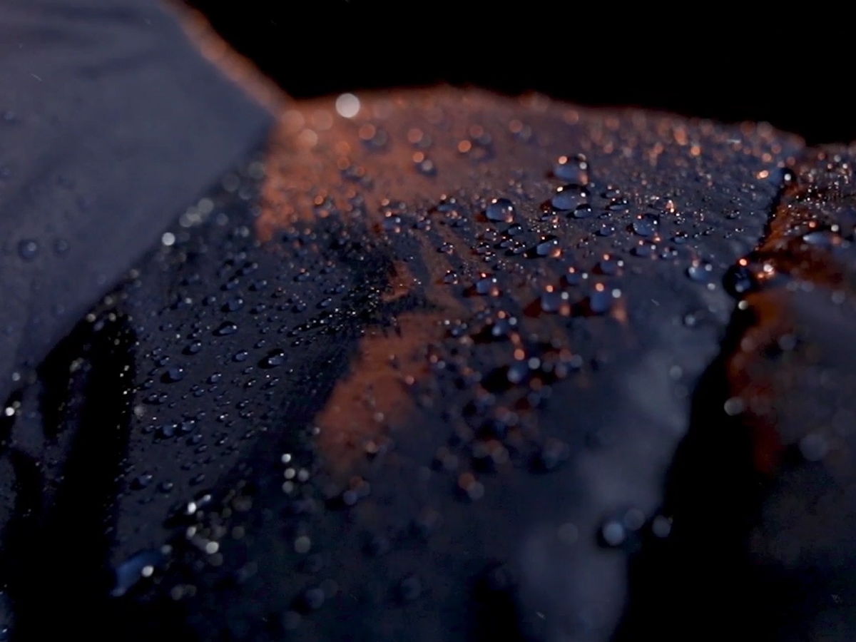 Water droplets beading on DownTek-treated fabric