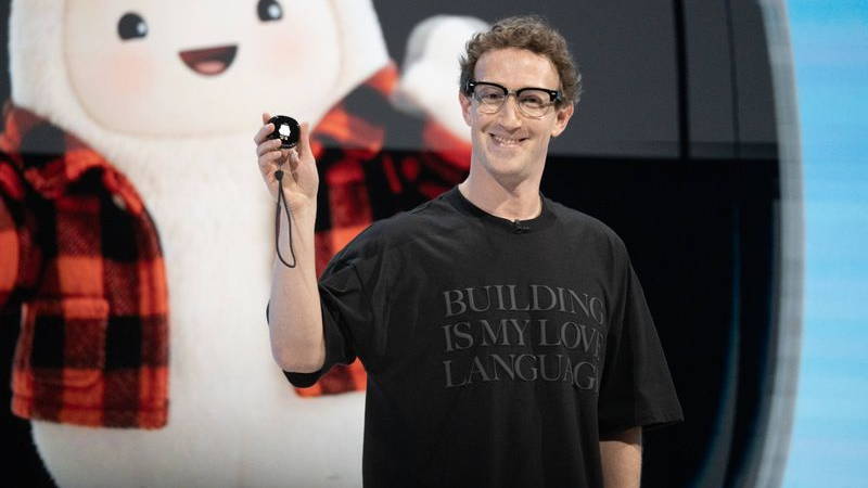 Image may contain: Mark Zuckerberg, Clothing, T-Shirt, Photography, Face, Head, Person, Portrait, Accessories, and Glasses
