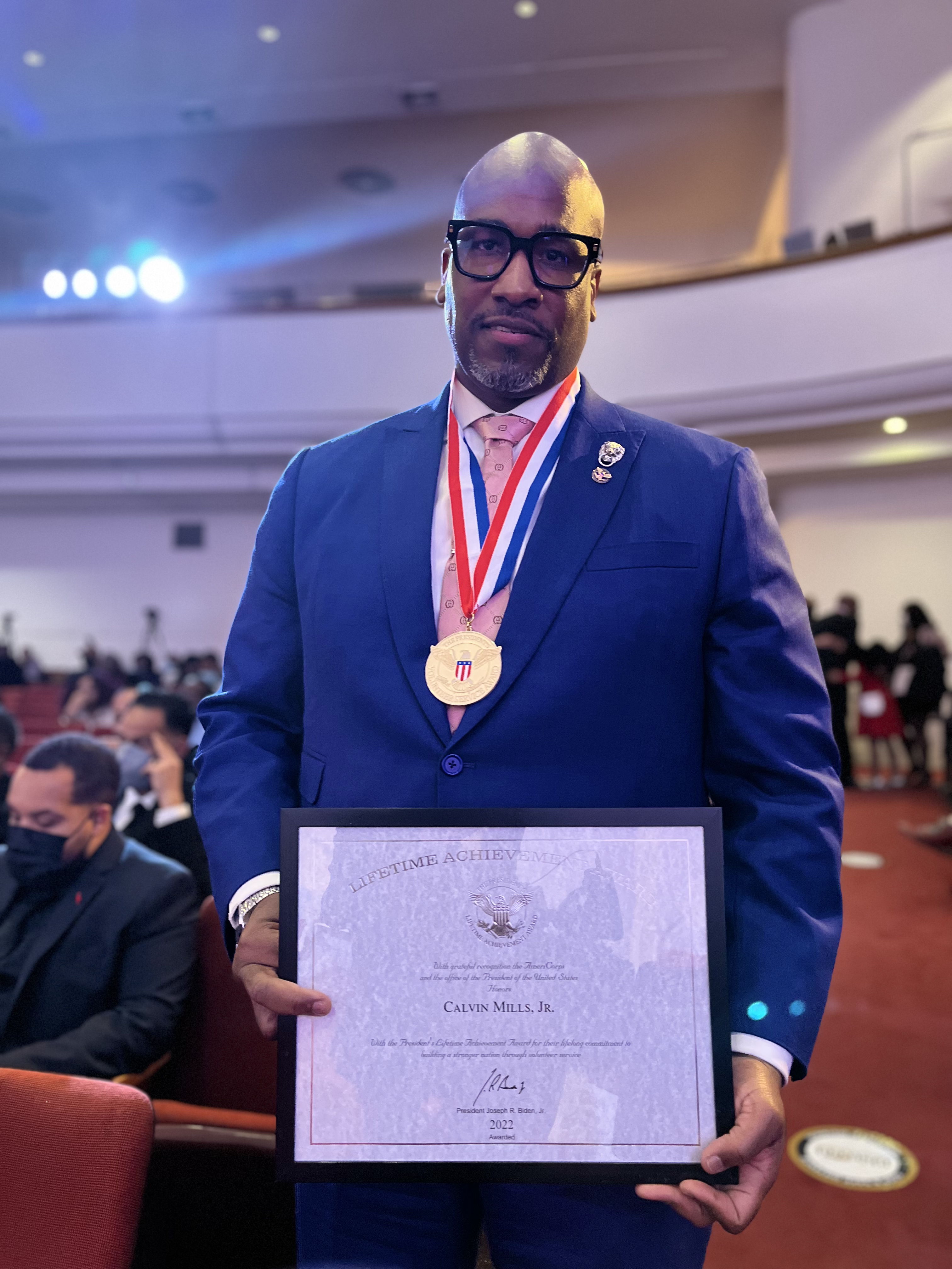 U.S. Presidential Lifetime Achievement Award — Posing with Medal & Official Certificate from the President of the United States