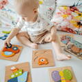 Baby playing with Montessori Happy Puzzles (6 Pack).