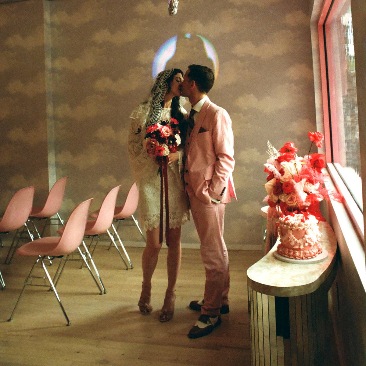 Bride and groom kissing at their wedding.