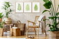 Set of three fern prints with house plants and a rattan chair, an example of bringing nature into your interior decor