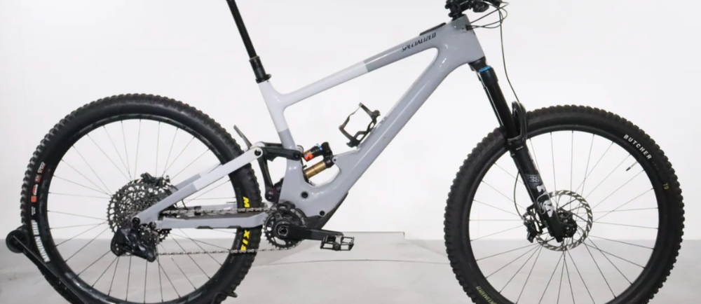 a grey and white Specialized Turbo Kenevo SL Expert full suspension electric mountain bike