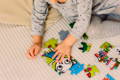 Toddler playing with puzzles. 