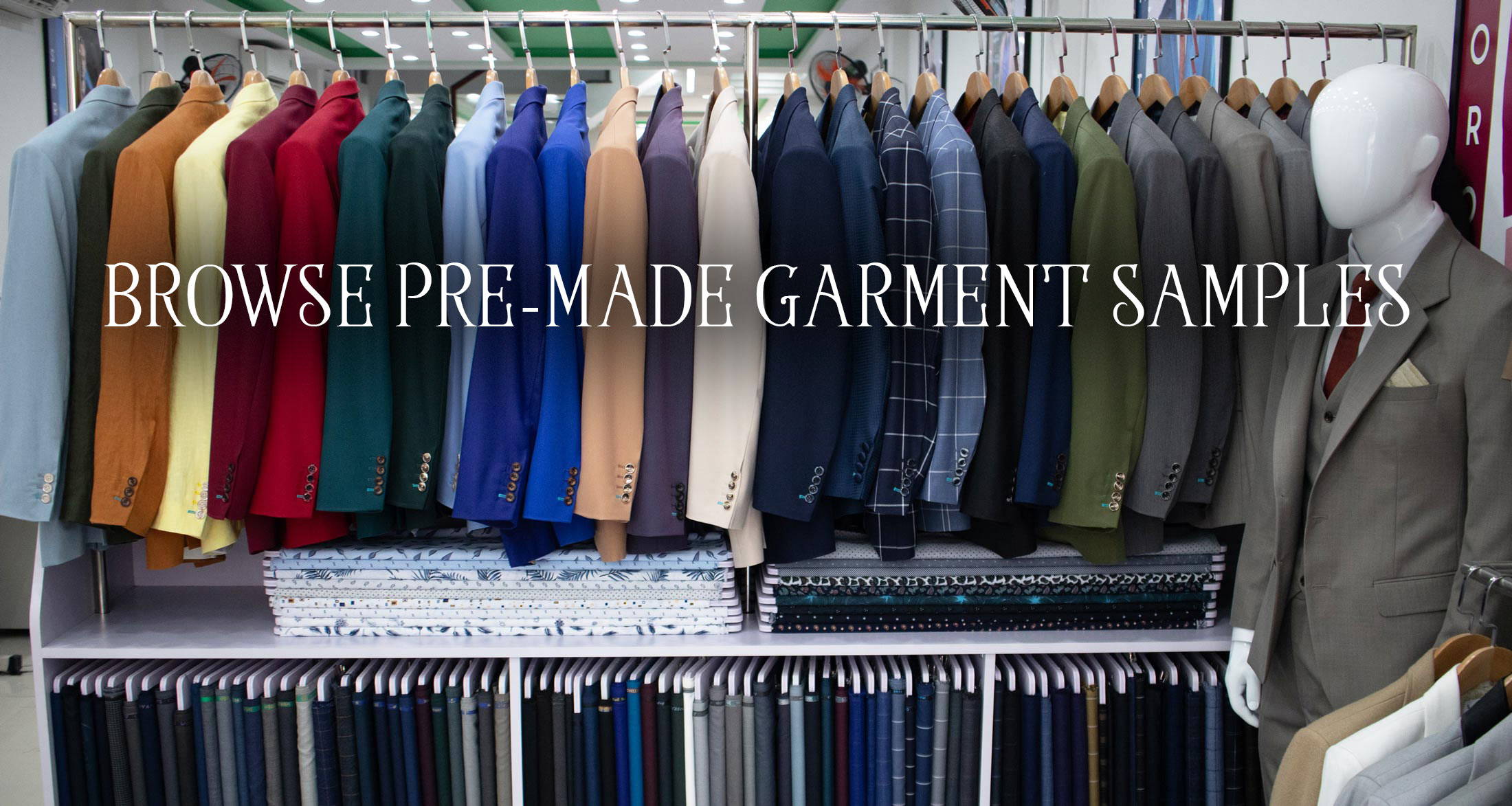 An array of 20 suits on a rack in different colors