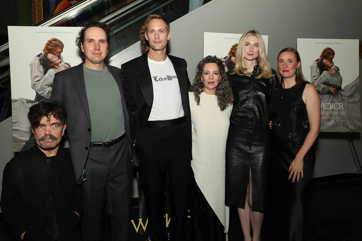 Image may contain: Alexander Skarsgård, Antony Partos, Olivia Colman, Elizabeth Debicki, Clothing, Coat, Jacket, and Adult
