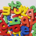 Close up on colorful letters form the Montessori Wooden Spelling Game set.