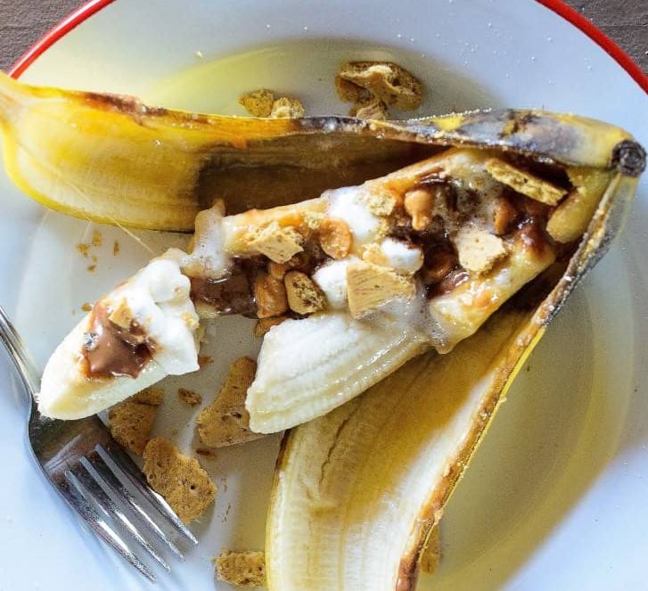 A banana with s'mores toppings