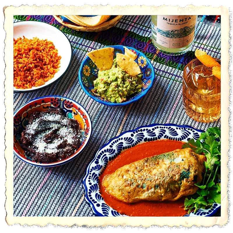 Prepared plate calabaza, sided by flowers and a mexican calavera stylized cup.