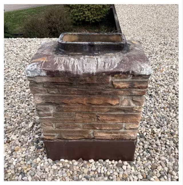 A old brick chimney showing signs of deterioration