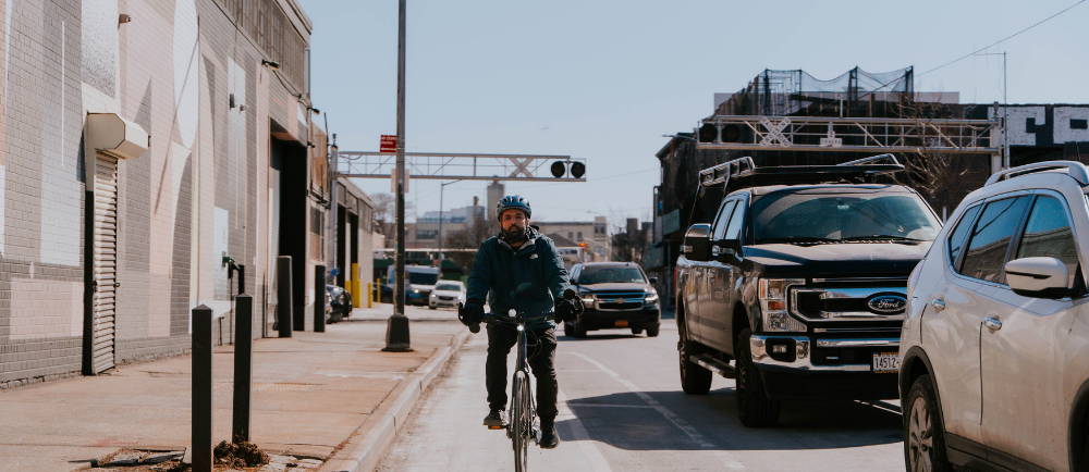 A man on a Turbo Vado SL 4.0 Specialized ebike in a city