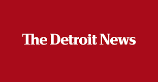 the detroit news red background white font