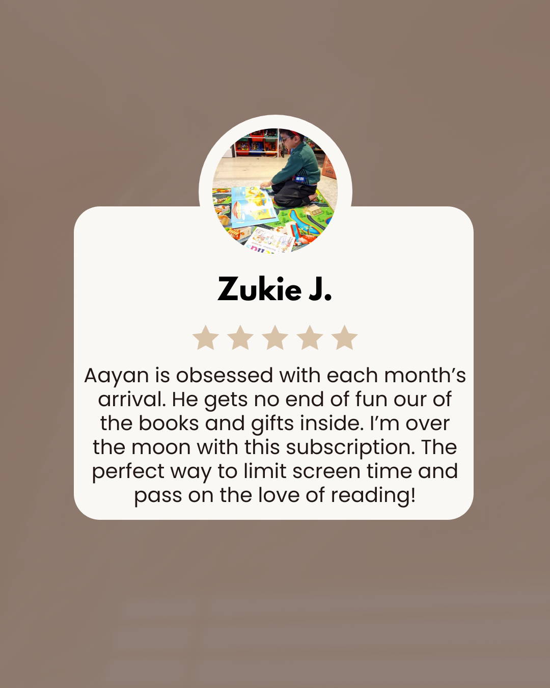 \Little boy reading a book from a Little Literates box