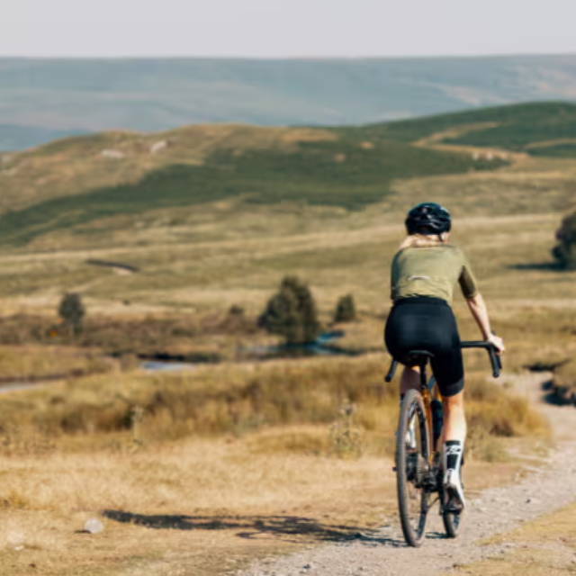 electric bike riding away on a gravel trail