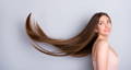 young woman with long brown hair swept up behind her - collagen can promote hair growth