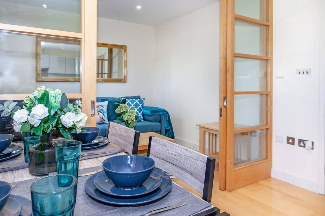 Kitchen with dining table facing into the living room