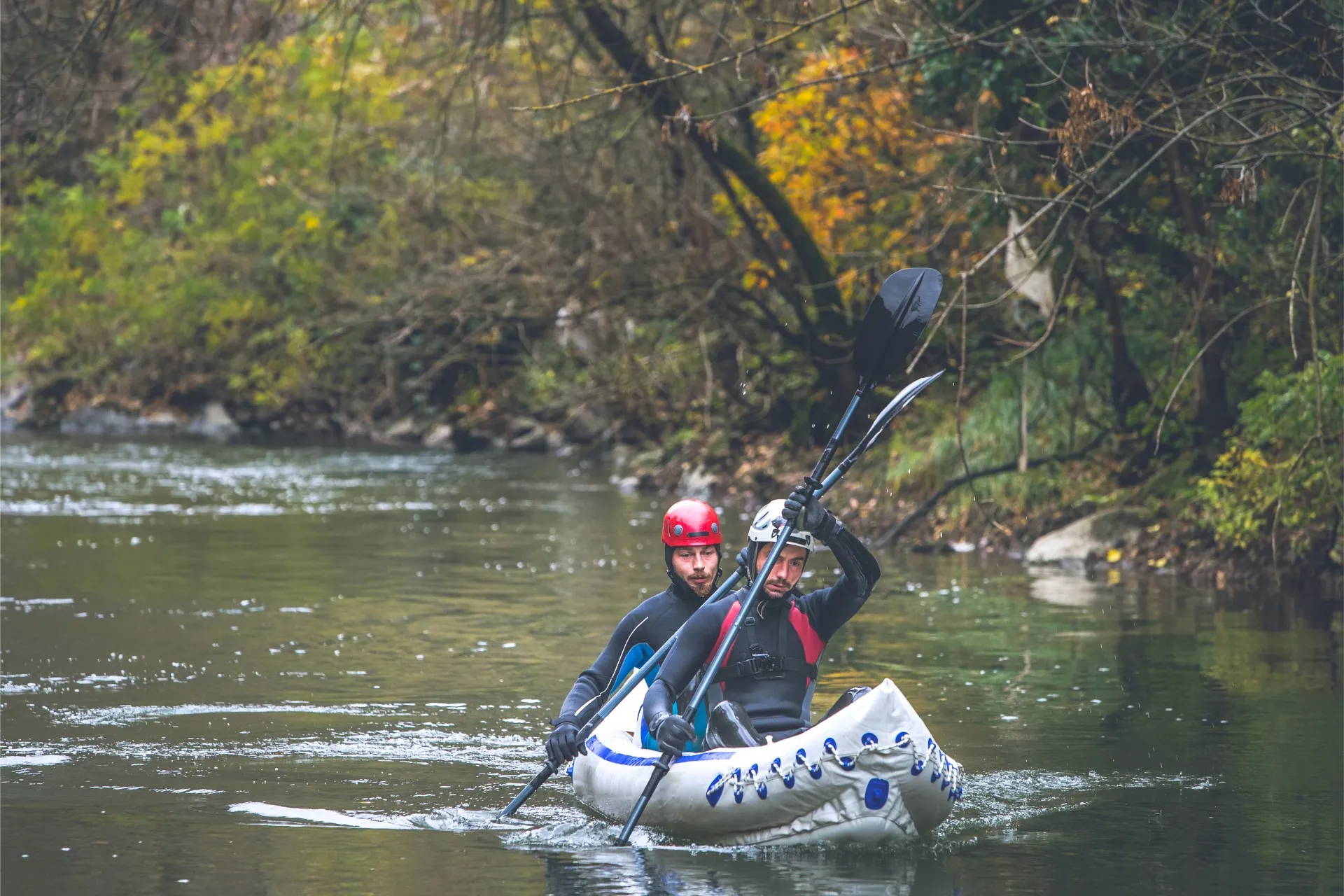Two kayakers training