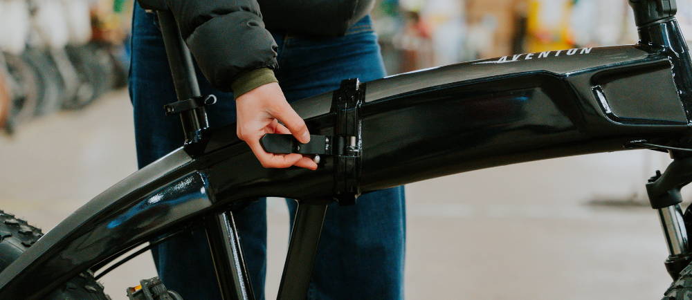 Woman folding Aventon Sinch electric bike