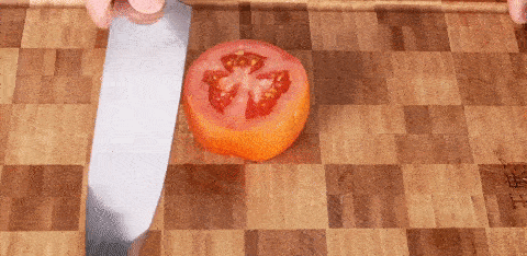 Seido Japanese master chef knife precisely slicing tomatoe