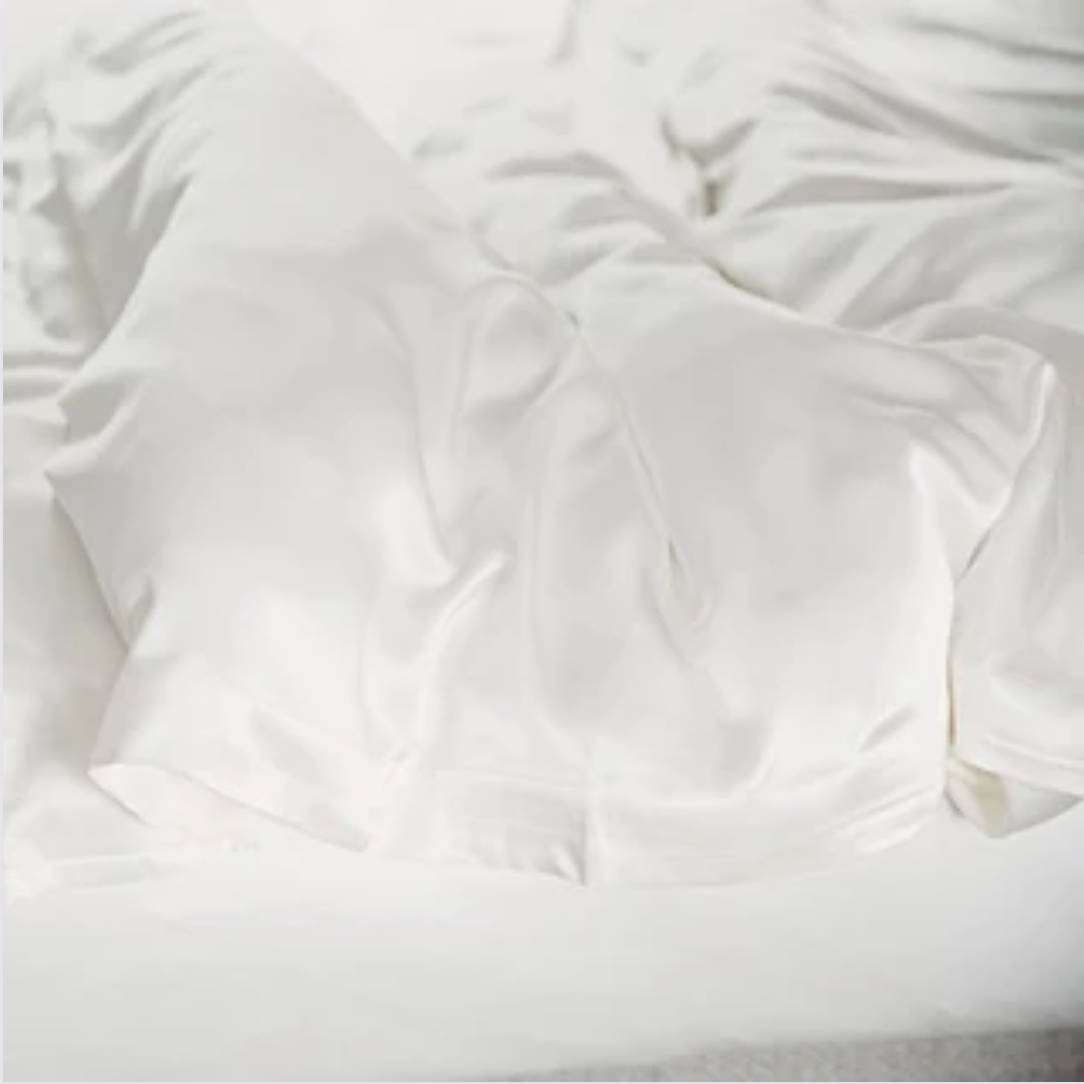 close up of a silk duvet cover being unfolded