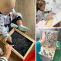 A little boy and a little girl drawing on a Magnetic Circus Board and putting magnet toys on it.