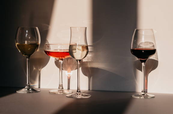 A variation of four different wine glasses; red, rosé, white, sparkling wine glasses dipslaying the importance of shape and size. 