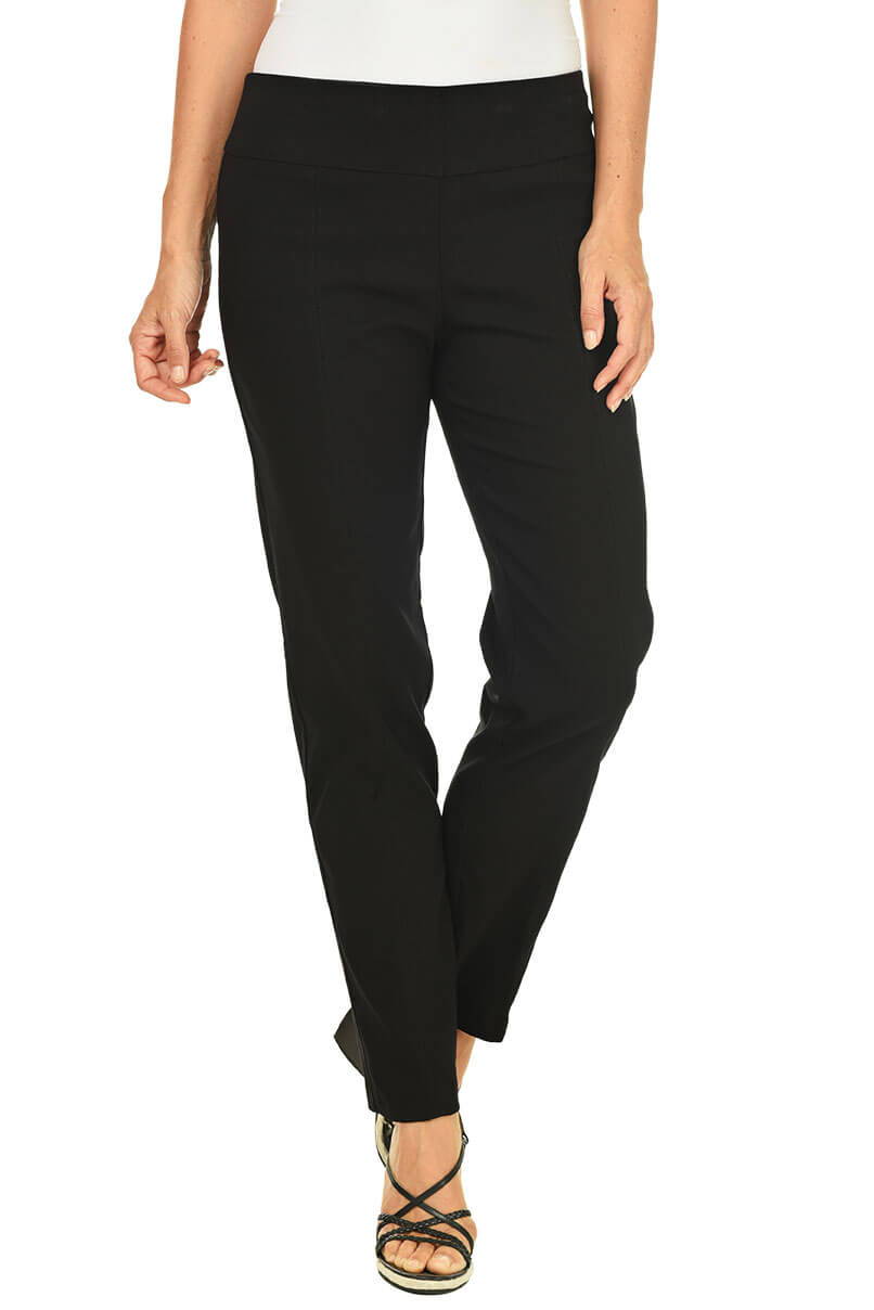 A woman wears a black pant against a white background