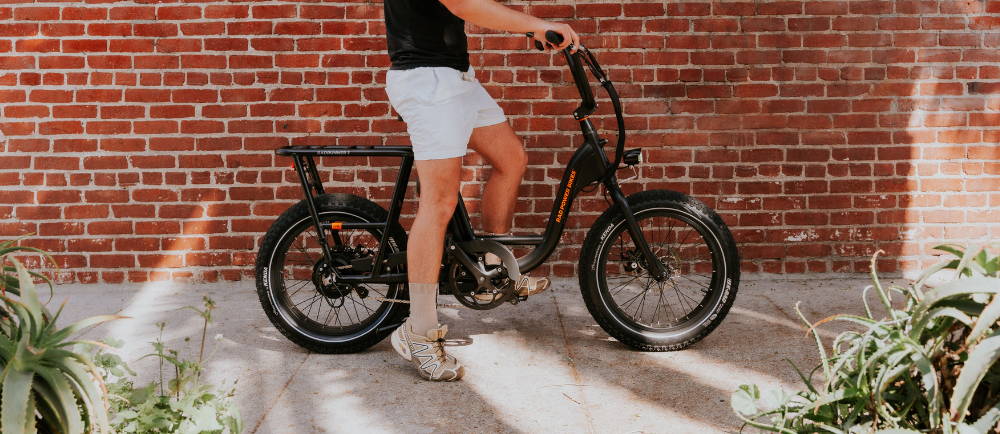 A Rad Power E-Bike against a brick wall