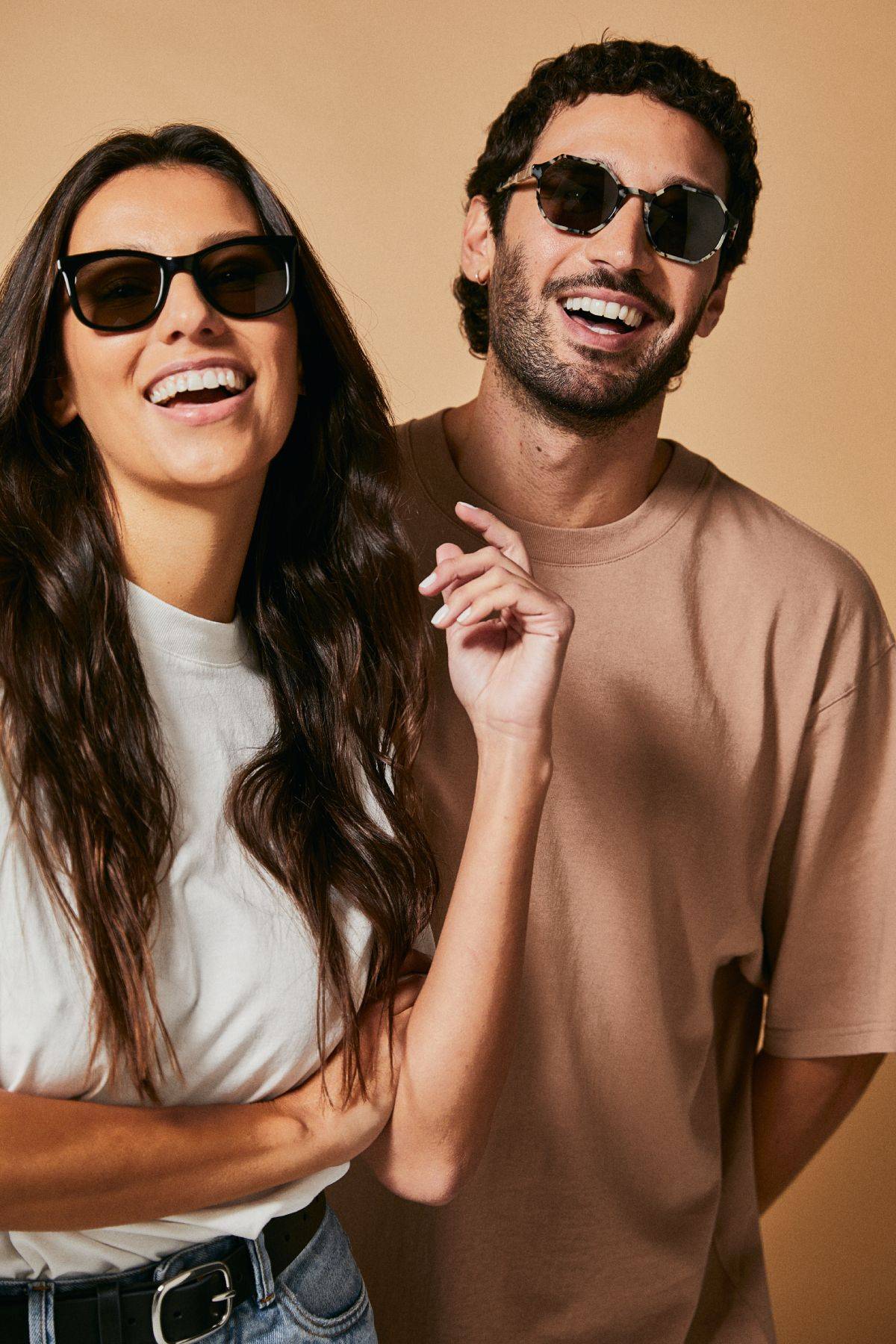 Male and female models wearing Ozeano polarised sunglasses