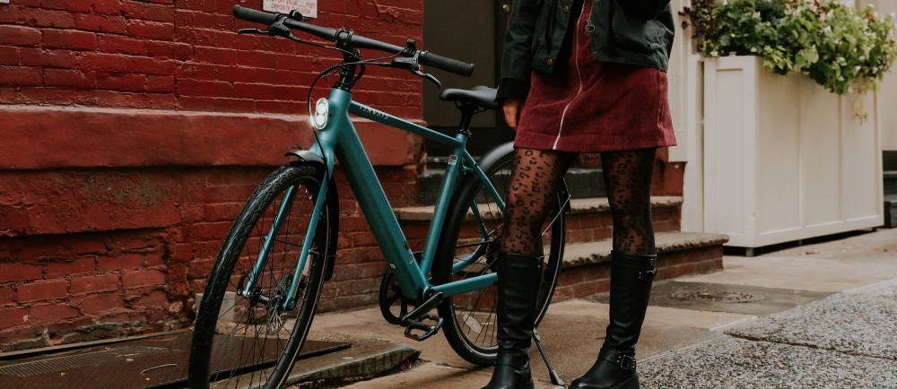 A Tenways E-Bike with a woman standing by it