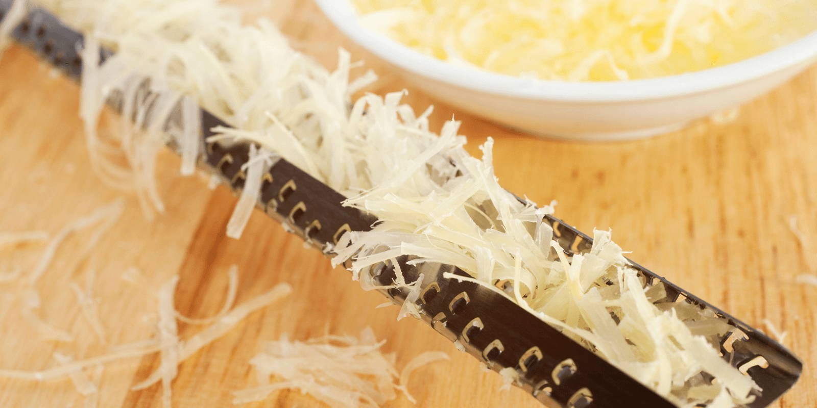 Close-up of parmesan cheese in a microplane.